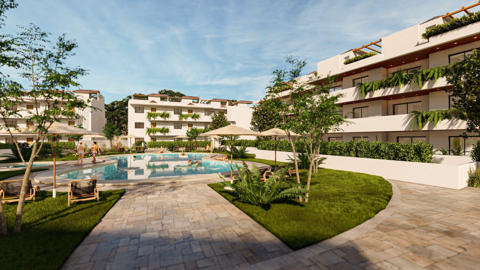 Jardines mediterráneos alrededor de la piscina en el patio interior de Coral Mijas Residencial